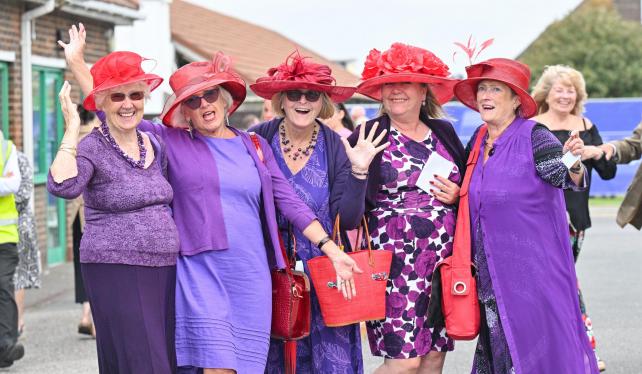 A group of women pose in their purple get-ups (Image: Simon Dack)